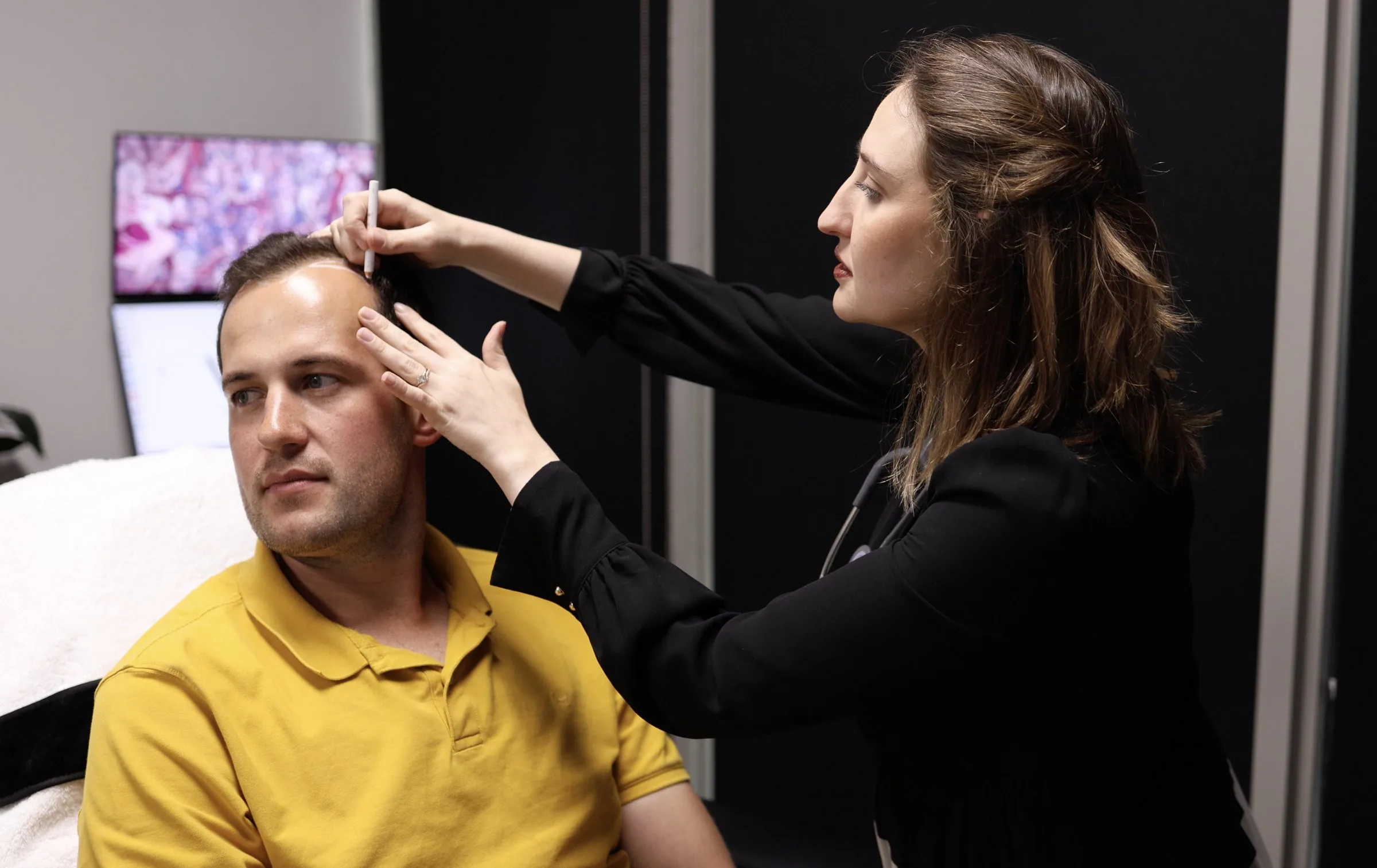 A West-Med clinician carrying out a treatment